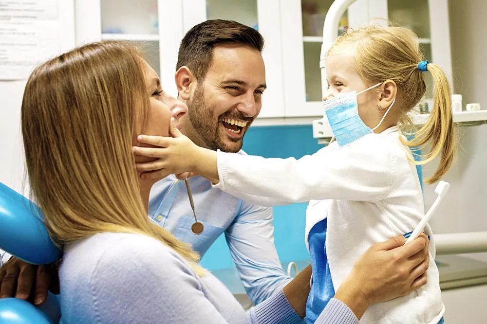 Happy family having fun in the dental office — dental clinic in Buderim, QLD