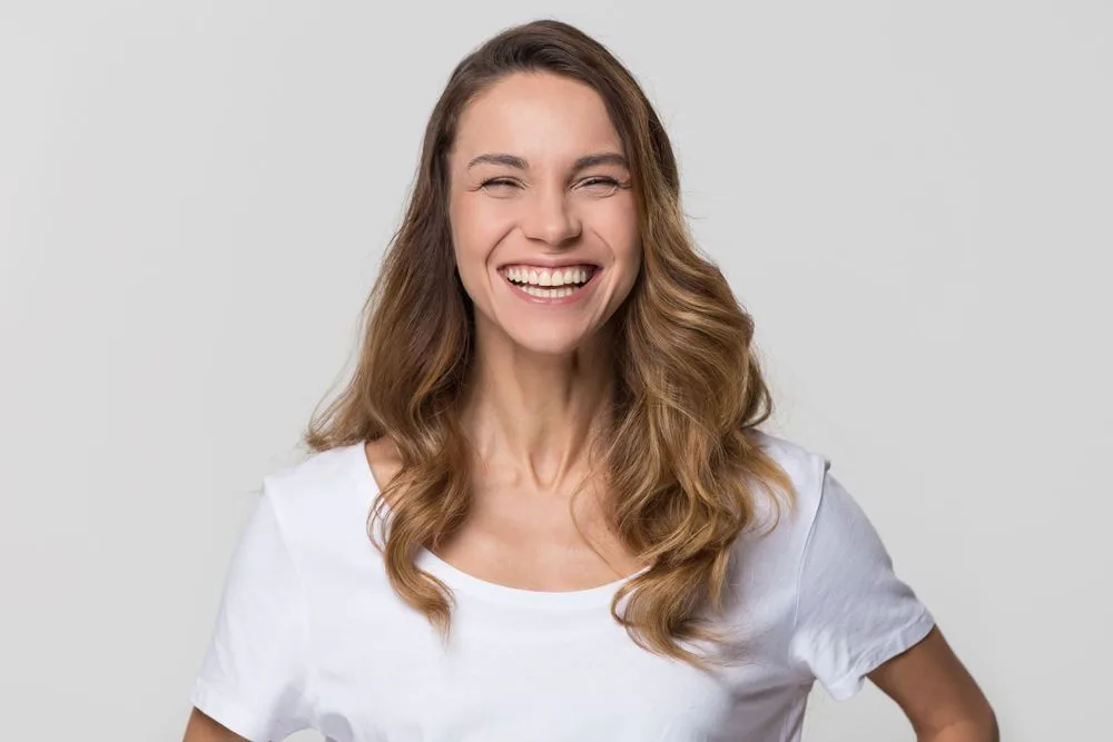 Woman laughing with a straight, healthy smile — dental clinic in Buderim, QLD