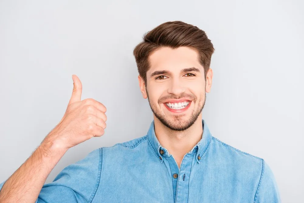 Smiling man giving a thumbs up after treatment — dental clinic in Buderim, QLD