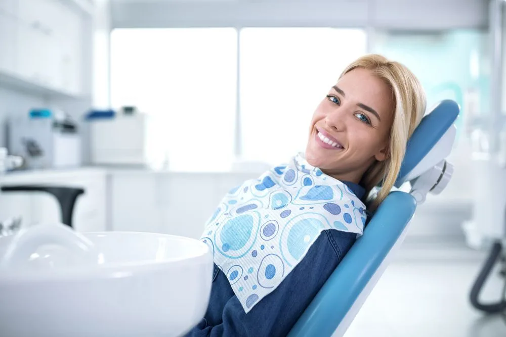Smiling and satisfied patient in the dental chair — dental clinic in Buderim, QLD