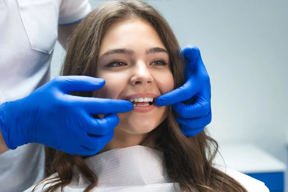 Close-up of a tooth examination with a dental mirror — dental clinic in Buderim, QLD