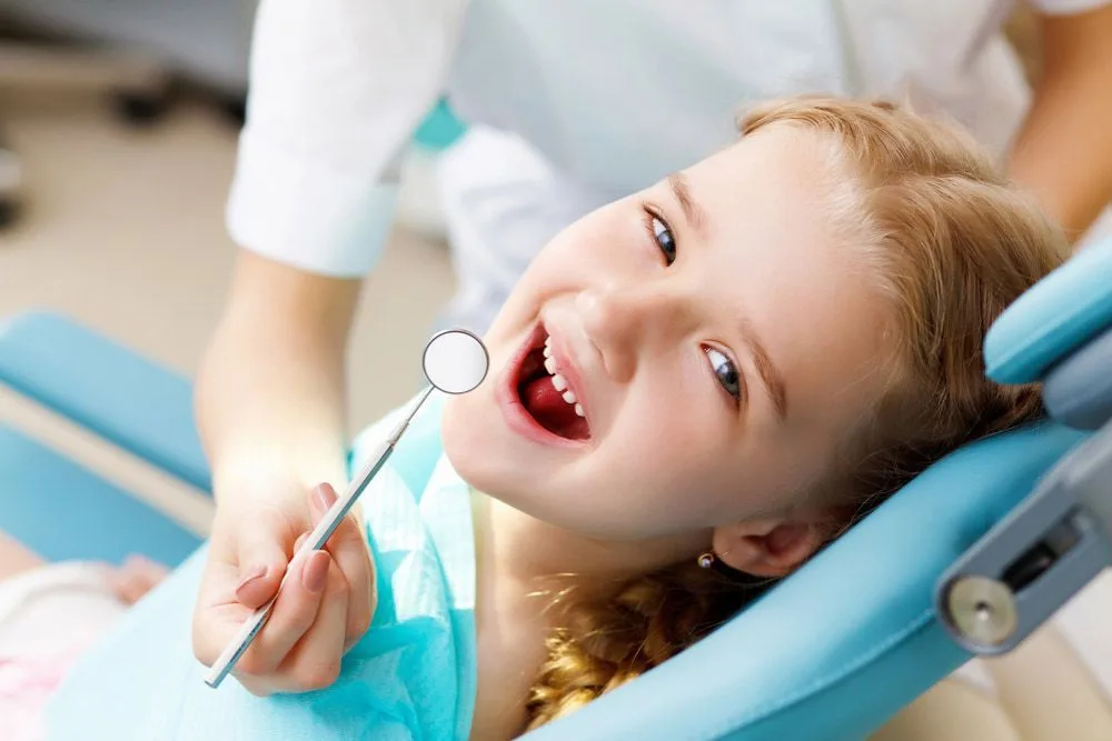Young child having their teeth checked in the dental chair — dental clinic in Buderim, QLD